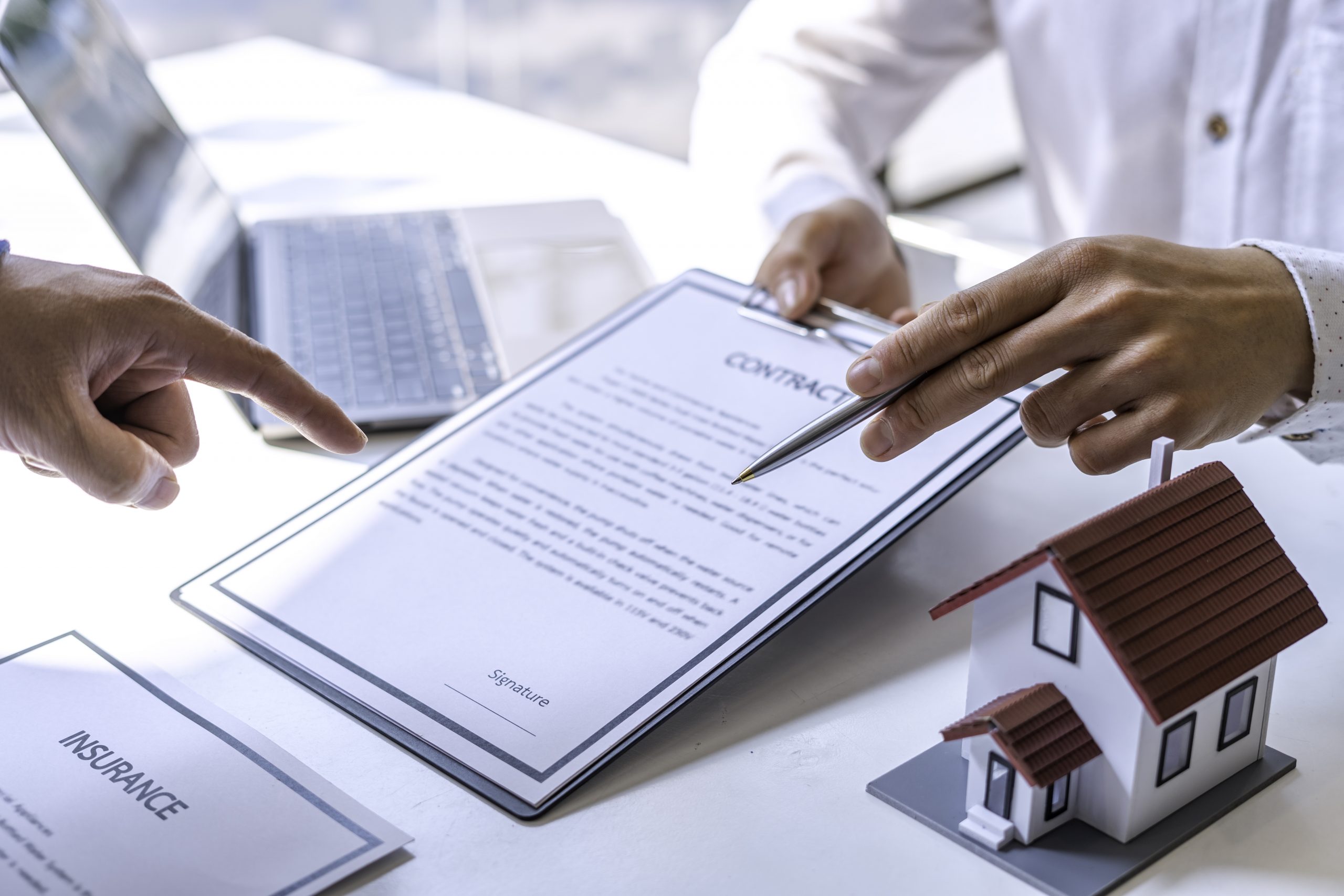 Real estate agents, agents, and visitors with hire purchase contracts In order for the customer to sign a contract according to an agreement for rent or purchase. The official home insurance concept.